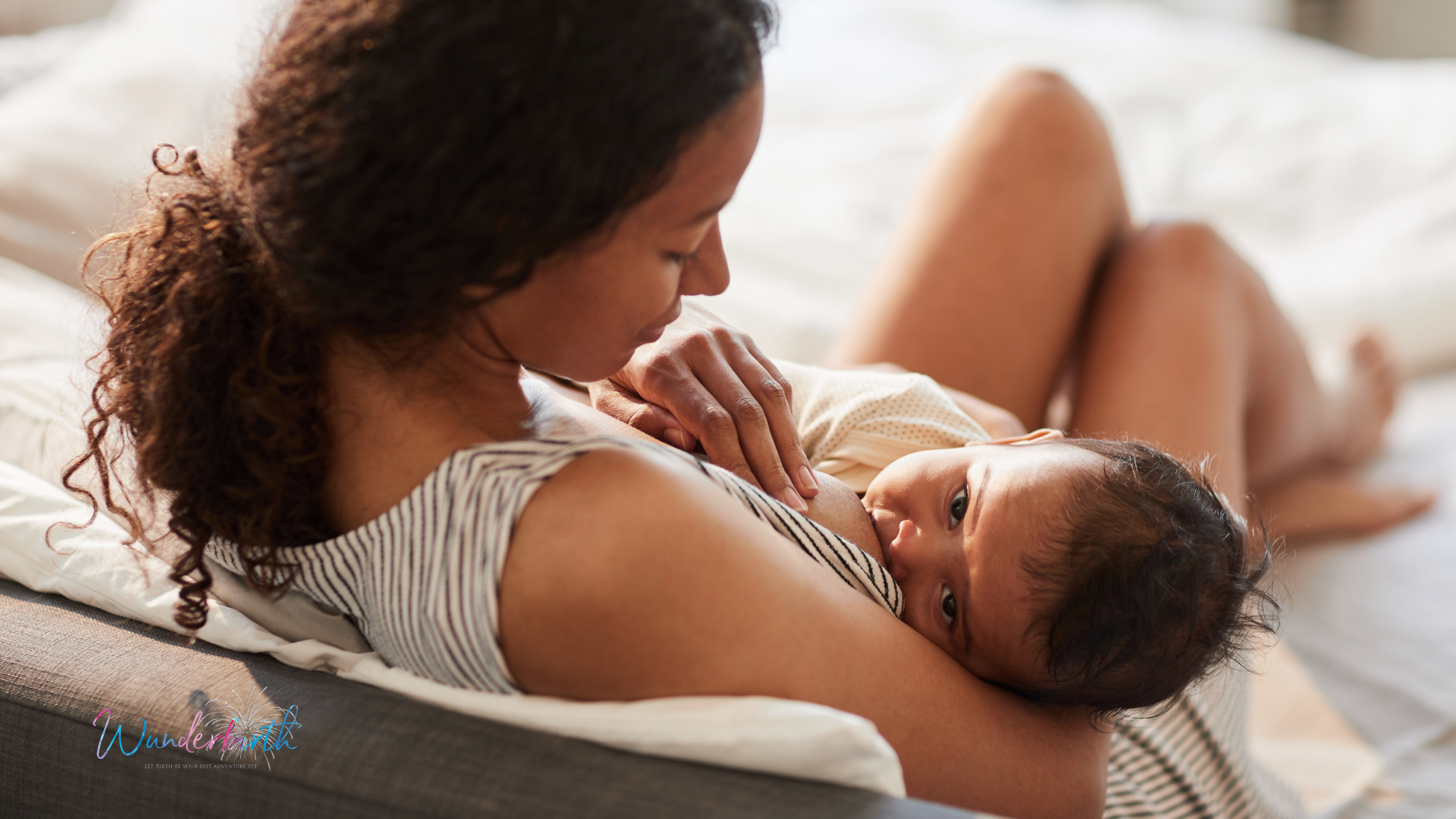 A mother breastfeeding her baby in a comfortable position, demonstrating tips about breastfeeding.