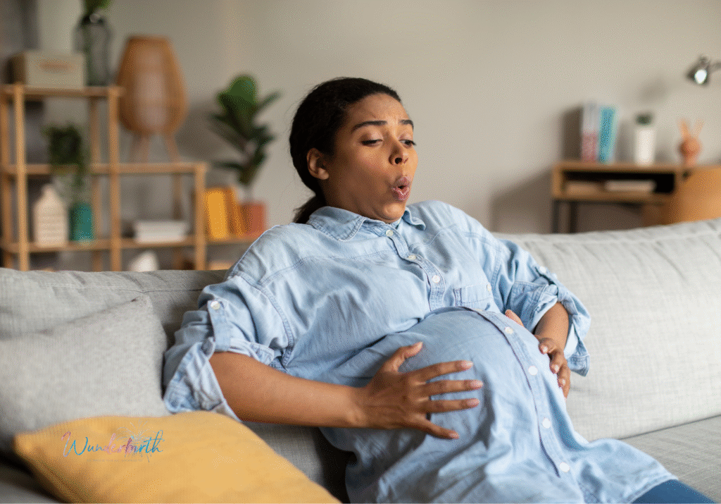 A pregnant woman at 40 weeks, experiencing baby movements.