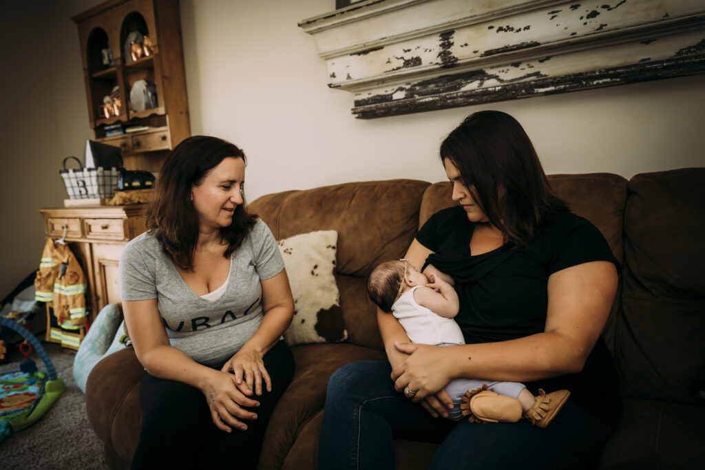 A midwife Yvonne Gray providing postpartum care to a new mother in Hawaii.