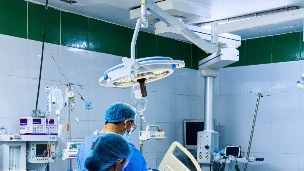 Doctor performing a birth Interventions in a hospital setting.