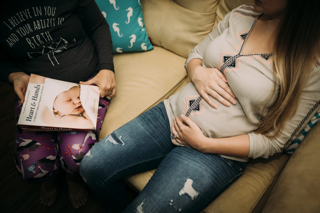 An photo depicting various home birth options, including midwife resources and books for the mother.
